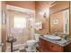 Elegant bathroom with a marble vanity, decorative mirror, and a shower at 2210 Se Laurel Run Dr, Ocala, FL 34471