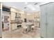 Bright kitchen with stainless steel appliances and an island with seating at 2210 Se Laurel Run Dr, Ocala, FL 34471