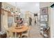 Bright breakfast nook with a round table, view to kitchen, and a pool view at 2210 Se Laurel Run Dr, Ocala, FL 34471