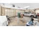 Spacious two-car garage with overhead storage and a car inside at 2210 Se Laurel Run Dr, Ocala, FL 34471