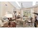 Elegant living room with a view of the backyard, hardwood floors and high ceilings at 2210 Se Laurel Run Dr, Ocala, FL 34471