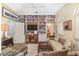 Cozy living room with built-in bookshelves, a comfortable sofa, and a fireplace at 2210 Se Laurel Run Dr, Ocala, FL 34471
