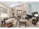Spacious living room with hardwood floors, fireplace and large windows at 2210 Se Laurel Run Dr, Ocala, FL 34471