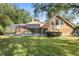 Backyard oasis with a screened-in pool and lush lawn at 2210 Se Laurel Run Dr, Ocala, FL 34471