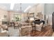 Open living room with hardwood floors, high ceilings, and lots of natural light at 2210 Se Laurel Run Dr, Ocala, FL 34471