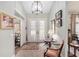 Light and airy entryway with hardwood floors and access to other rooms at 2210 Se Laurel Run Dr, Ocala, FL 34471