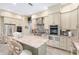 Modern kitchen with stainless steel appliances and a large granite island at 2210 Se Laurel Run Dr, Ocala, FL 34471