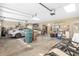 Two-car garage with ample storage and a car parked inside at 2210 Se Laurel Run Dr, Ocala, FL 34471