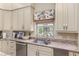 Spacious kitchen with granite countertops, stainless steel appliances, and an island at 2210 Se Laurel Run Dr, Ocala, FL 34471