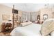Main bedroom featuring a built-in shelving unit and a comfortable sitting area at 2210 Se Laurel Run Dr, Ocala, FL 34471