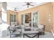 Relaxing covered patio with comfortable seating overlooking the pool area at 2210 Se Laurel Run Dr, Ocala, FL 34471