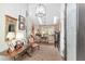 Bright and spacious entryway with decorative chandelier and hardwood floors at 2210 Se Laurel Run Dr, Ocala, FL 34471