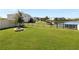 Large backyard with fire pit and lake view at 5584 Sw 43Rd Ct, Ocala, FL 34474
