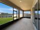 Screened porch overlooking a backyard and lake at 5584 Sw 43Rd Ct, Ocala, FL 34474