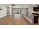 Open concept kitchen features granite island and stainless steel appliances at 5584 Sw 43Rd Ct, Ocala, FL 34474