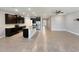 Modern kitchen with dark wood cabinets, granite island and stainless steel appliances at 5584 Sw 43Rd Ct, Ocala, FL 34474
