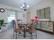 Dining room with chandelier and glass-top table at 10783 Se 178Th St, Summerfield, FL 34491