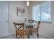 Small breakfast nook with glass-top table and chairs at 10783 Se 178Th St, Summerfield, FL 34491