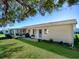 House exterior with backyard, patio, and landscaping at 10783 Se 178Th St, Summerfield, FL 34491