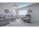 Comfortable living room featuring gray sectional sofa at 10783 Se 178Th St, Summerfield, FL 34491
