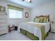Charming bedroom with a queen-size bed and a dresser at 10783 Se 178Th St, Summerfield, FL 34491