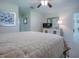 Large bedroom with a dresser and a flat-screen TV at 10783 Se 178Th St, Summerfield, FL 34491