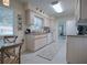 Kitchen with white appliances, wood cabinets, and breakfast nook at 10783 Se 178Th St, Summerfield, FL 34491