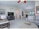Bright living room with gray sofa and fireplace at 10783 Se 178Th St, Summerfield, FL 34491