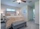 Spacious bedroom with plush bedding and a cozy bench at 10783 Se 178Th St, Summerfield, FL 34491