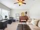 Bright home office features a large desk, piano, and comfortable seating at 8335 Se 162Nd Pl, Summerfield, FL 34491