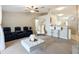Living room with a comfortable seating area and a home bar at 8335 Se 162Nd Pl, Summerfield, FL 34491