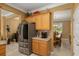 Kitchen with stainless steel refrigerator and coffee bar at 11703 Se 91St Cir, Summerfield, FL 34491