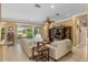 Spacious living room with comfortable seating and large TV at 11703 Se 91St Cir, Summerfield, FL 34491