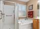 Bathroom with walk-in shower and soaking tub at 11703 Se 91St Cir, Summerfield, FL 34491