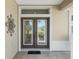 Elegant double front doors with decorative glass panes at 11703 Se 91St Cir, Summerfield, FL 34491