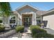 Well maintained home exterior with attractive landscaping and walkway at 11703 Se 91St Cir, Summerfield, FL 34491