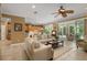 Bright living room with ample seating and access to the lanai at 11703 Se 91St Cir, Summerfield, FL 34491