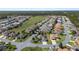 Aerial view of community, featuring various houses and green spaces at 11703 Se 91St Cir, Summerfield, FL 34491