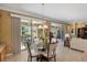 Kitchen features a breakfast nook and access to a screened patio at 11703 Se 91St Cir, Summerfield, FL 34491