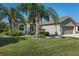 One-story home with two-car garage and landscaping at 11703 Se 91St Cir, Summerfield, FL 34491