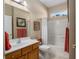 Clean bathroom with single sink, tub, and shower at 11703 Se 91St Cir, Summerfield, FL 34491