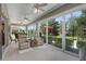 Spacious sunroom with seating and access to backyard at 11703 Se 91St Cir, Summerfield, FL 34491