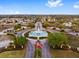 Community entrance with fountain and flag at 11703 Se 91St Cir, Summerfield, FL 34491