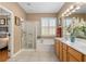 Elegant bathroom features double sinks, shower, and garden tub at 11703 Se 91St Cir, Summerfield, FL 34491