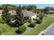Landscaped backyard with patio and lush greenery at 11703 Se 91St Cir, Summerfield, FL 34491