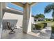 Relaxing front porch with seating area and view of neighborhood at 11703 Se 91St Cir, Summerfield, FL 34491