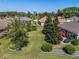 Spacious backyard with mature trees and landscaping at 11703 Se 91St Cir, Summerfield, FL 34491