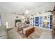 Bright and airy living room with comfortable seating and a large fish tank at 14185 Sw 30Th Pl, Ocala, FL 34481