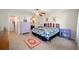 Main bedroom with ceiling fan, large closet, and neutral carpeting at 14185 Sw 30Th Pl, Ocala, FL 34481