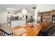 Open kitchen with stainless steel appliances and granite countertops, flows into the dining area at 14185 Sw 30Th Pl, Ocala, FL 34481